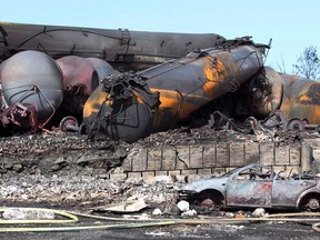 Wrecked oil tankers and debris from a runaway train in Lac-Megantic, Que. are pictured July 8, 2013. A Quebec judge has rejected Canadian Pacific Railway Ltd.'s challenge of a court settlement aimed at compensating residents of Lac-Megantic. THE CANADIAN PRESS/ho, SQ