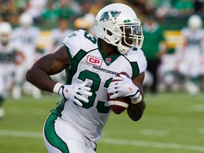 Jerome Messam of the Saskatchewan Roughriders carries the ball against the Edmonton Eskimos during CFL action in Edmonton, Alta., on Friday July 31, 2015. (THE CANADIAN PRESS/Topher Seguin)