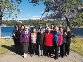 Women's emergency shelter staff during a recent retreat to Waterton Lakes National Park. Back row: Janet Sauerwein, Doris Sweet Grass (Director, Kainai Women’s Wellness Lodge attending as  guest), Julie Coleman, Nicole Weasel Bear (hiding), Lori Vanee, Lisa Dupuis, Tressa Yellow Horn. Front row: Veronica Smith, Earlene Healy, Mildred Crow Eagle, Alene Bastien, Dana Bruised Head, Vicki Pruden (retreat facilitator), Elaine Potts, Stacey Grier. Photo courtesy of Julie Coleman