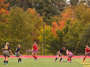 The Medway Cowboys and the Strathroy Saints play field hockey at the City Wide Fields as the fall colours start to colour the trees in London, Ont. on Tuesday October 6, 2015. All eight TVRA schools played shorter games, allowing them to get three games in per team on the two turf fields. Medway won 3-0 over the Saints. Mike Hensen/The London Free Press/Postmedia Network