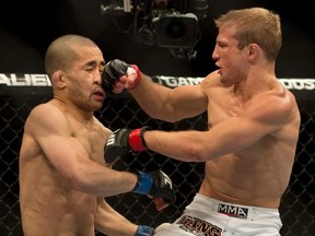 T.J. Dillashaw, right, lands a punch to the face of Issei Tamura during UFC 158 at the Bell Centre in Montreal. (Postmedia Network file photo)