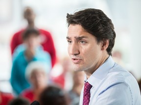Liberal leader Justin Trudeau speaks at a rally at Goodwill Industries during a campaign stop in London, Ontario on October 7, 2015.  (AFP PHOTO/GEOFF ROBINS)