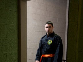 Amateur MMA fighter Brandon Collings poses for a photo ahead of a martial arts class at the Trinity United Church in London, Ont. on Tuesday October 6, 2015. (CRAIG GLOVER, The London Free Press)