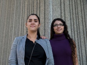Domestic assault victim Natalia Jimenez, left, stands outside the court house with her friend, Andrea Amigon, in London. (Free Press file photo)