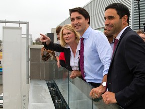 London North Centre Liberal candidate Peter Fragiskatos points out aspects of London?s core Wednesday to Liberal Leader Justin Trudeau, who is flanked by London-Fanshawe candidate Khalil Ramal and London West candidate Kate Young. (MIKE HENSEN, The London Free Press)