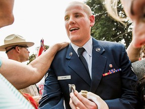 Spencer Stone, who helped thwart an attack on a French train last August, greets fans during a celebration honoring them in Sacramento, Calif., Sept. 11, 2015. REUTERS/Max Whittaker