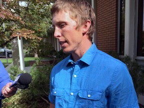 Stephen Vouch, of Boise,  Idaho, talks to a reporter on Wednesday, Oct. 7, 2015 at the Idaho Department of Fish and Game and describes being bitten in the back of the head by a black bear while he slept at a hunting camp in central Idaho on Oct. 2. (AP Photo/Keith Ridler)