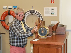 Duc D'Olrleans captain Ken Bracewell stands at a replica of the wheel of the original Duc, the HMC Q105, at Sombra Museum. Bracewell spoke about his experience with the original Duc D'Orleans during a presentation at the museum on Sept. 29.
CARL HNATYSHYN/SARNIA THIS WEEK