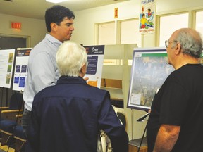 Vulcan residents Peter and Myrtle Collis chat with an EDF En Canada official Sept. 29 during an open house at Carmangay’s curling rink for a proposed 60 megawatt solar park near Carmangay. Stephen Tipper Vulcan Advocate