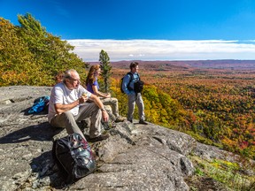 Michael Burtch, left, and Joanie and Gary McGuffin are featured in Painted Land: In Search of the Group of Seven, a documentary made by Queen's University grad Peter Raymont's company. The documentary airs Thursday on TVOntario. (Supplied photo)