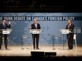 Liberal leader Justin Trudeau (L), Conservative leader and Prime Minister Stephen Harper, and New Democratic Party (NDP) leader Thomas Mulcair (R) take part in the Munk leaders' debate on Canada's foreign policy in Toronto on September 28, 2015. This is one of the closest federal election races in recent history. REUTERS/Mark Blinch
