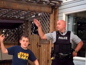 Barrhead RCMP officer Robert Hynes and his 9 year old son Kempton dance to adjust to their home/community. A video was posted to Facebook and is getting a lot of views.  Supplied/Edmonton Sun/Postmedia
