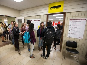Students line up to cast their ballot at an advance polling station that allows out-of-town voters to vote in their native riding in the University Community Centre at Western University in London, Ont. on Thursday October 8, 2015. (CRAIG GLOVER, The London Free Press)