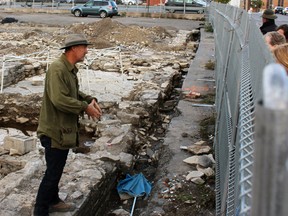Looking into the past; 18 people took a tour of the archaeology dig at the corner of Queen and Wellington streets in Kingston, Ont. on Thursday October 8, 2015. Steph Crosier/Kingston Whig-Standard/Postmedia Network