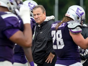 Western Mustangs head coach Greg Marshall watches as his team walks off the field. (Free Press file photo)