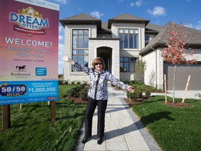 Michelle Campbell, president and CEO of St. Joseph?s Health Care Foundation, shows off the Dream Lottery home on Meadowland Way in London. (DEREK RUTTAN, The London Free Press)