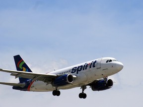 In June 2015 photo, a Spirit Airlines plane approaches Chicago O'Hare International Airport in Chicago. There are few businesses that consumers love to hate more than airlines, but travellers seem to reserve a special level of vitriol for the no-frills, discount airlines. (Bill Montgomery/Houston Chronicle via AP)