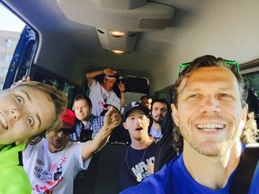 Dave Stickland (right) takes a selfie while on the road with members of the Street Soccer London soccer team. (Photo submitted)