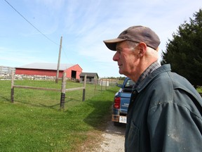 Bob Lawson, 79, stands in front of his barn near the village of Vanastra. To the right of him is the notorious Lawson’s Bush where 12-year-old Lynne Harper’s lifeless body was found in 1959.(Shaun Gregory/Huron Expositor)