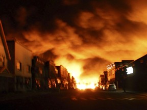 Fire from an oil train explosion is seen in Lac-Megantic, Que., in this July 6, 2013 file photograph. (REUTERS/Stringer/Files)