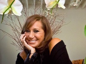 In this Oct. 5, 2015 photo, fashion designer Donna Karan poses during an interview in New York. Karan has a memoir coming out next week "My Journey," a volume chock full of very personal, entertaining anecdotes.  (AP Photo/Bebeto Matthews)