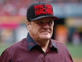 Former Cincinnati Red Pete Rose stands on the field at Great American Ball Park before a MLB baseball game ine Cincinnati on Sept. 12, 2015. (AP Photo/John Minchillo)