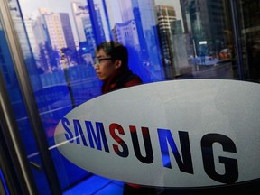 A man walks out of Samsung Electronics' headquarters in Seoul, in this Jan. 6, 2014 file picture. REUTERS/Kim Hong-Ji/Files