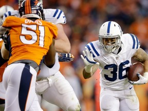 Dan Herron of the Indianapolis Colts rushes against the Denver Broncos during a 2015 AFC Divisional Playoff game at Sports Authority Field at Mile High in Denver on January 11, 2015. (Ezra Shaw/Getty Images/AFP)