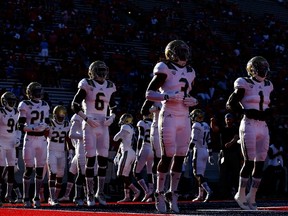 UCLA players warm up before a college football game in September 2015. (Christian Petersen/AFP)