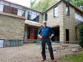 Patrick Malloy, owner of Duo Building Ltd., in front of a `green? renovation project in London. Malloy says only about one in 50 homeowners is interested in such responsible building practices. (DEREK RUTTAN, The London Free Press)
