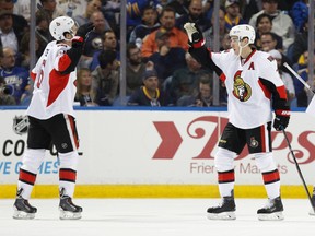 Oct 8, 2015; Buffalo, NY, USA; Ottawa Senators center Kyle Turris (7) celebrates his second goal of the night with right wing Mark Stone (61) during the second period against the Buffalo Sabres at First Niagara Center. Mandatory Credit: Kevin Hoffman-USA TODAY Sports