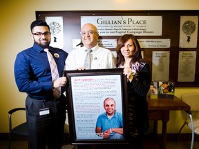 (left) Aleem Merani, brother, Moe Merani and Nazlin Merani, parents, family of Arif Merani who was killed while changing a tire on the QEW, are photographed in front of the donor wall at Gillian's Place on Wednesday, March 5, 2014. The family has raised $13,001.00 for the shelter. This coming September, Aleem will climb North Africa’s highest peak in the Atlas Mountains in memory of his brother and to support the work of two organization closes to Arif’s heart - Gillian's Place and the Aga Khan Foundation of Canada.  
Postmedia file photo