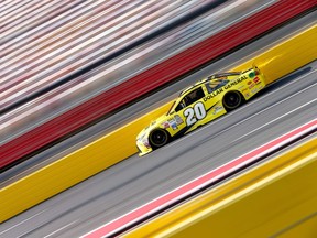 Matt Kenseth, driver of the #20 Dollar General Toyota, drives during practice for the NASCAR Sprint Cup Series Bank of America 500 at Charlotte Motor Speedway in Charlotte, N.C., on Oct. 9, 2015. (Jonathan Ferrey/Getty Images/AFP)