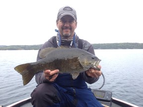 Local guide and tournament angler Frank Clark shows a 5.5-pound smallmouth bass caught earlier this week. Fall is the time to target giant smallmouth.