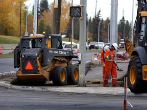 Crews work on a new sidewalk on 50 st and 92 ave in Edmonton, Alta., on Friday October 9, 2015. Perry Mah/Edmonton Sun