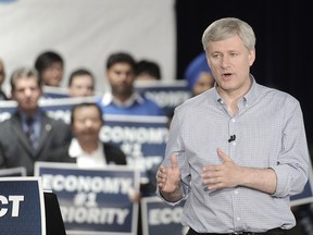 Prime Minister Stephen Harper unveils his low-tax, balanced-budget plan on the campaign trail in Richmond, B.C., October 9, 2015 Nick Procaylo/Vancouver Province/Postmedia Network