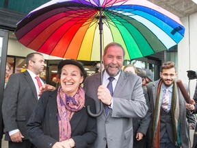 NDP leader Tom Mulcair and his wife Catherine, leaves the polling station after voting in the advance poll Friday, October 9, 2015 in Montreal. THE CANADIAN PRESS/Ryan Remiorz