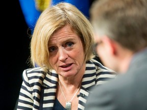 Premier Rachel Notley speaks with Calgary Chamber of Commerce president and CEO Adam Legge after her Chamber address at the BMO Centre in Calgary, Alta., on Friday, Oct. 9, 2015. It was Notley's first address to the Calgary Chamber Lyle Aspinall/Calgary Sun/Postmedia Network