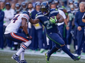 Seahawks running back Marshawn Lynch (right) will miss Sunday's game against the Bengals. (Otto Greule Jr/Getty Images/AFP)