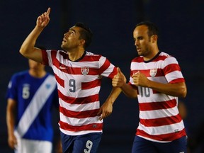 U.S forward Herculez Gomez (9) celebrates his first half goal with teammate Landon Donovan after scoring against Guatemala during their friendly soccer match in San Diego, California July 5, 2013. The friendly is a tune-up game for the American team before entering into the CONCACAF  Gold Cup.  REUTERS/Mike Blake