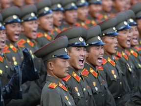 North Korean soldiers march during a military parade in Pyongyang, North Korea, Saturday, Oct. 10, 2015. North Korean leader Kim Jong Un declared Saturday that his country was ready to stand up to any threat posed by the United States as he spoke at a lavish military parade to mark the 70th anniversary of the North's ruling party and trumpet his third-generation leadership. (AP Photo/Wong Maye-E)