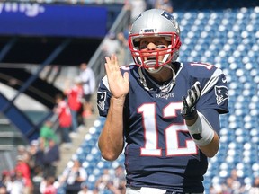 Tom Brady #12 of the New England Patriots reacts before a game with the Jacksonville Jaguars at Gillette Stadium on September 27, 2015 in Foxboro, Massachusetts.   Jim Rogash/Getty Images/AFP