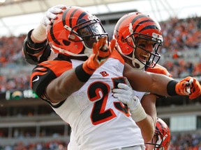 In this Sept. 20, 2015, file photo, Cincinnati Bengals tight end Tyler Eifert, right, celebrates with running back Giovani Bernard (25) after scoring a touchdown in the second half of an NFL football game against the San Diego Chargers in Cincinnati. Coming off a short week and a mediocre, to be kind, performance, the Seahawks head to Cincinnati, where the Bengals are undefeated and looking like, well, what we'd expect from Seattle. (AP Photo/Gary Landers, File)