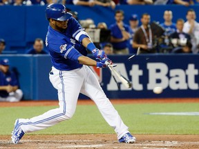 Edwin Encarnacion of the Toronto Blue Jays breaks his bat in the 3rd inning against of the Texas Rangers during game 2 of the best-of-five American League Division Series at the Rogers Centre in Toronto, Ont. on Friday October 9, 2015. (Stan Behal/Postmedia Network)