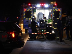 In this file photo, a Niagara Regional Police officer is loaded into an ambulance after being shot at a Fenwick apartment building on October 10, 2015. The alleged shooter, Corey Richardson, 29, of Port Colborne, was charged Thursday by police. (Greg Furminger/Postmedia file photo)