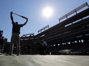 Toronto Blue Jays' Josh Donaldson stretches as he waits to hit during an American League Division Series baseball practice Oct. 10 in Arlington, Texas. The Blue Jays will face the the Texas Rangers in game 3 Sunday. (AP Photo/Eric Gay)