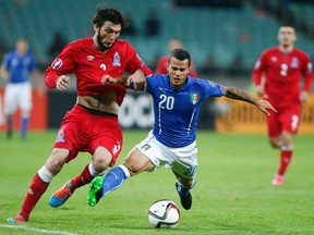 Italy’s Sebastian Giovinco (right) and Azerbaijan’s Badavi Huseynov give chase during their Euro 2016 Group H qualifying match on Saturday. (Reuters)