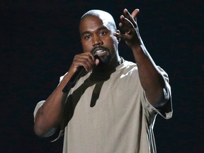 Entertainer Kanye West accepts the Video Vanguard Award at the 2015 MTV Video Music Awards in Los Angeles, California, August 30, 2015.  President Barack Obama poked a litte fun at West on Saturday for saying he planned to run for the White House and offered some tongue-in-cheek advice on how to achieve a successful political career.   REUTERS/Mario Anzuoni/Files