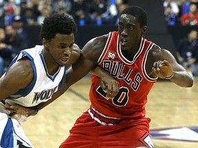 Minnesota Timberwolves Andrew Wiggins drives on Chicago Bulls  Tony Snell during NBA exhibition action at MTS Centre. (KEVIN KING/Winnipeg Sun)