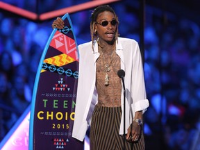 In this Aug. 16, 2015, file photo, Wiz Khalifa accepts the choice R&B/hip-hop song award for “See You Again” at the Teen Choice Awards at the Galen Center in Los Angeles. Pittsburgh police say rapper Wiz Khalifa has been cited for urinating in public. (Photo by Matt Sayles/Invision/AP, File)